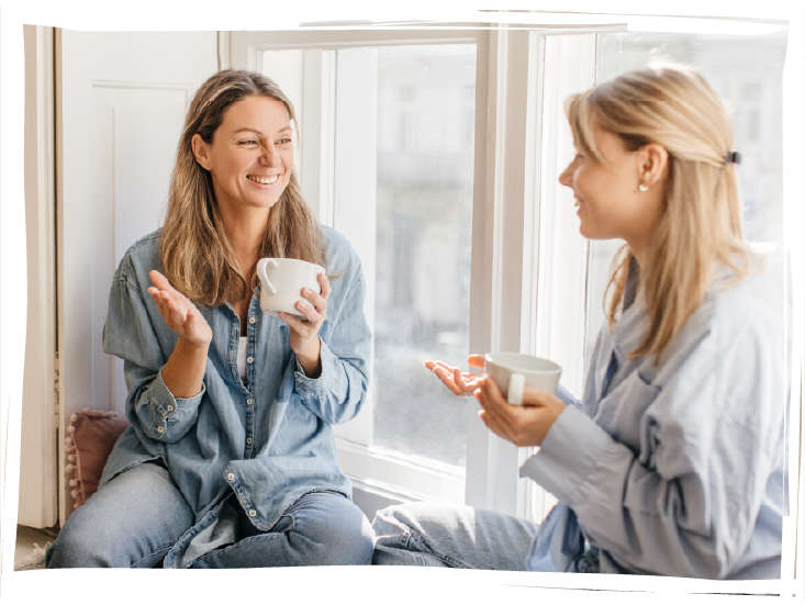 two women drinking tea together