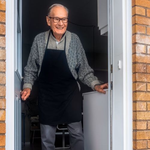 Man standing at this front door