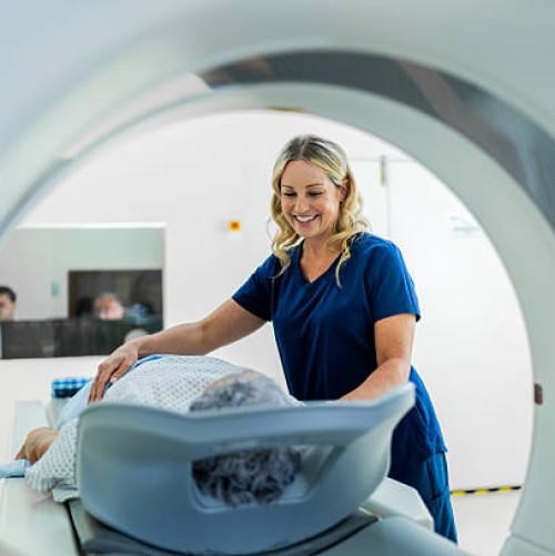 Nurse assisting patient going into a scanner