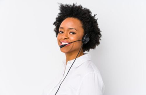 A woman wearing a telephone headset