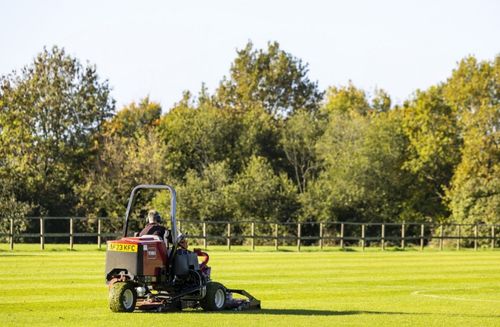 A person riding a lawn mower