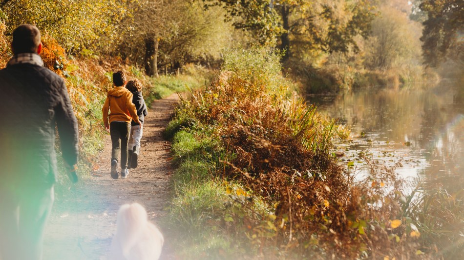 Family walking along a canal