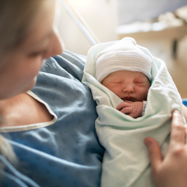 Mother holding a new-born baby