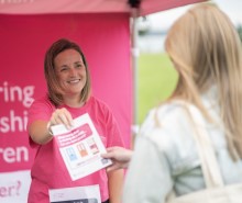 Ladies at Fostering event stand