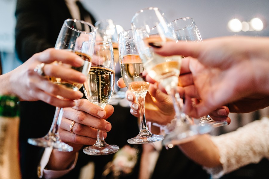 A group of people clinking champagne flutes