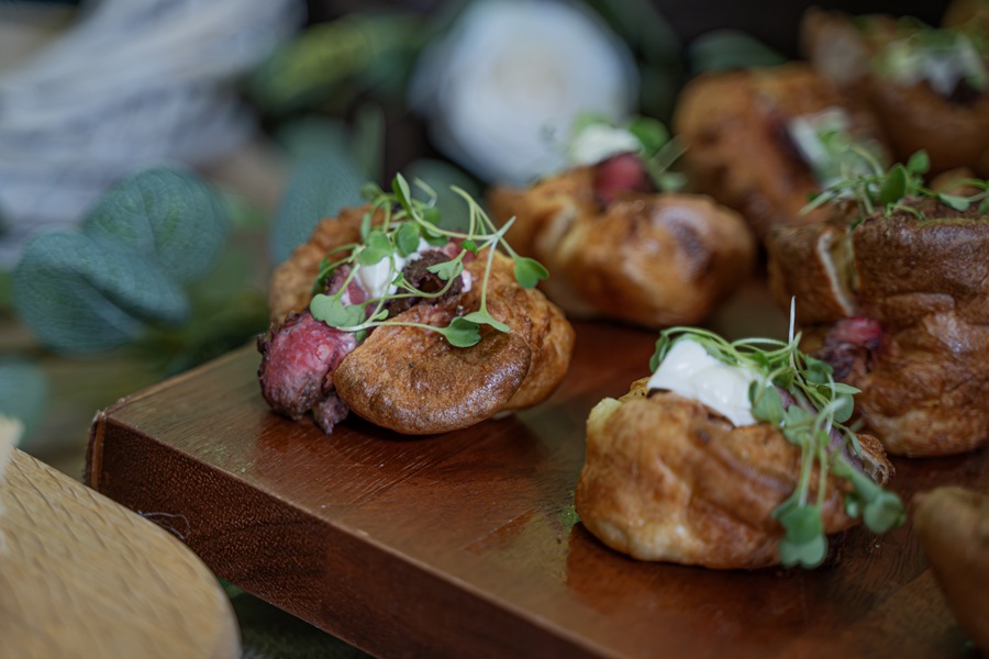 Several mini Yorkshire puddings on a display plate