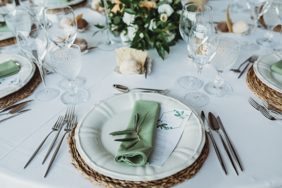 Table set-up for a wedding with knives, forks and plates