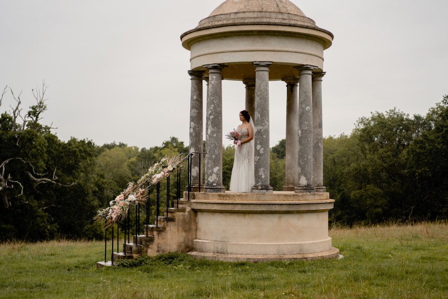 A bride standing in a folly in Staunton Country Park