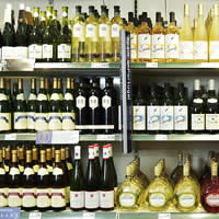 shop shelves filled with various glass bottles