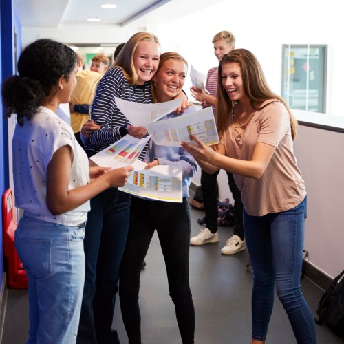 group of sixth form girls celebrating exam success