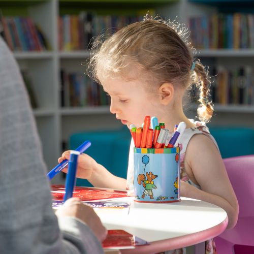 Little girl doing colouring activity