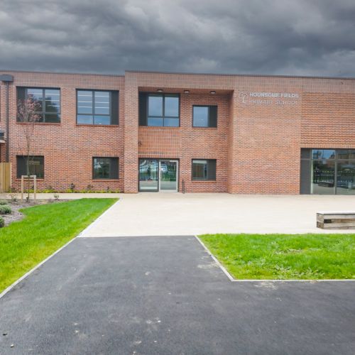 Image shows external view of Hounsome Fields Primary School
