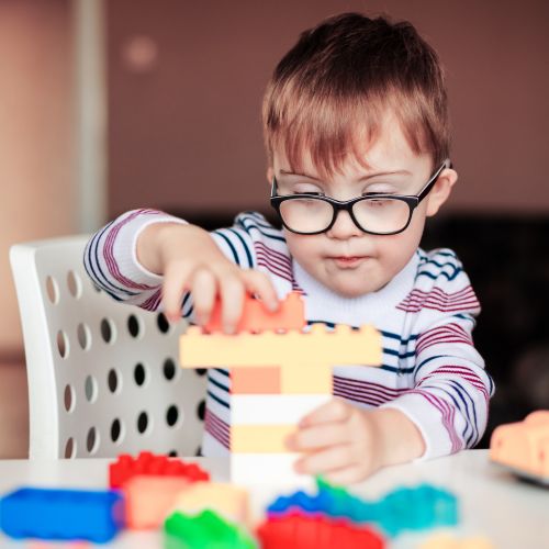 Child playing with building blocks