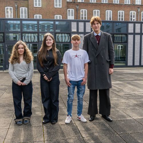 Group shot of new Members of Youth Parliament stood outside Hampshire County Council