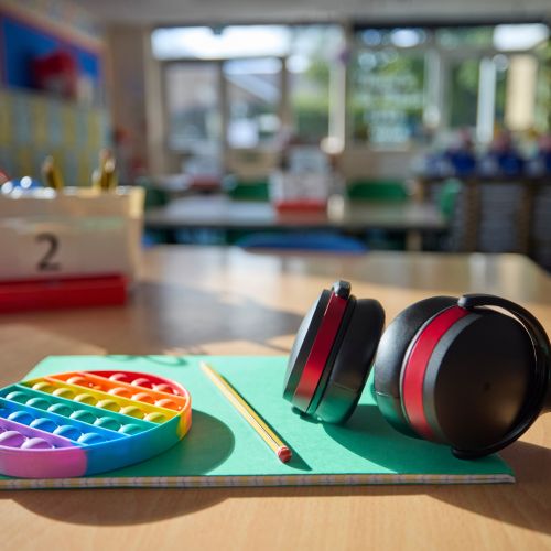Headphones and a fidget toy