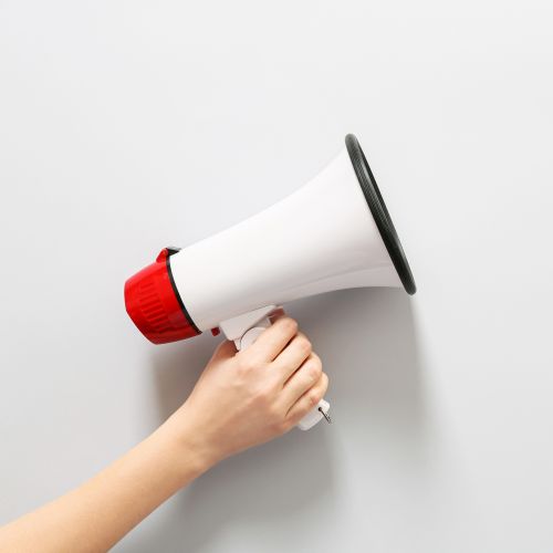 Hand holding megaphone