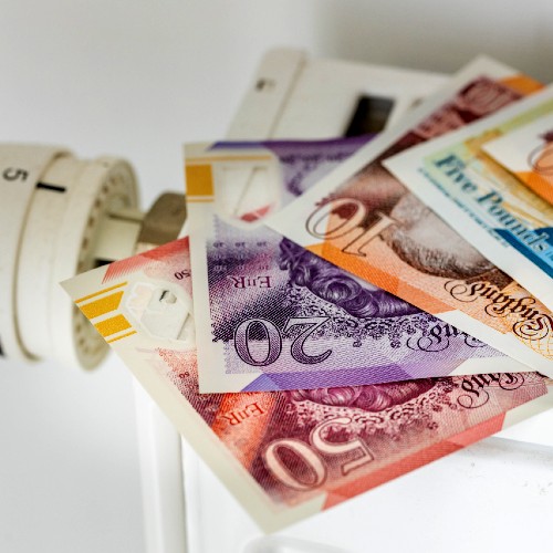 photo shows uk money on top of a radiator