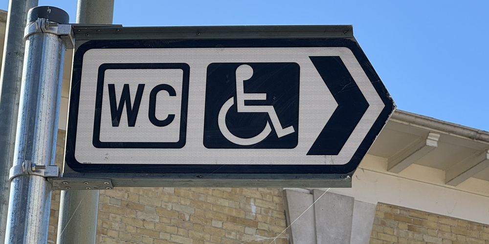 Pic shows outdoor sign for a disabled toilet