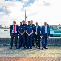 travel safe officers and partner council representatives in Gosport with Spinnaker Tower in background