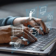 Hands on a computer keyboard while learning on a Skills Bootcamp training course