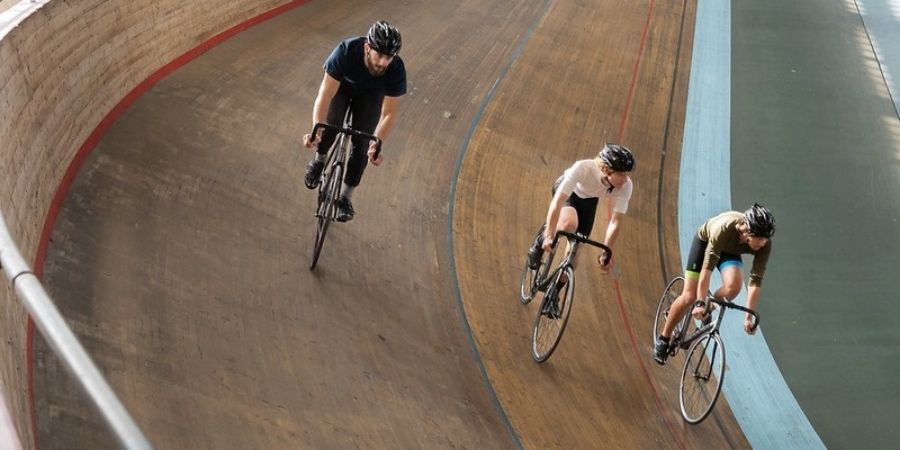People cycling on the velodrome