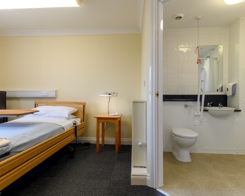 Photo of a bedroom with en suite at Woodcot Lodge
