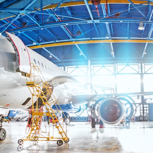 Aeroplane maintenance being carried out in a hangar