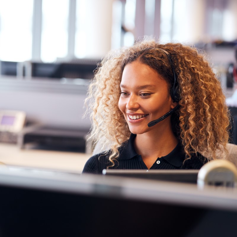 Women in a office with headset on