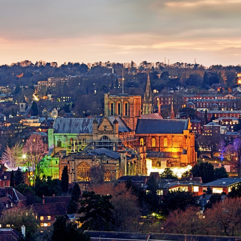 Aerial view of Winchester Cathedral illuminated at night
