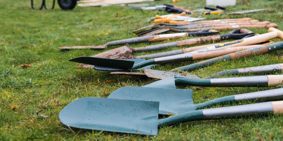 Shovels laying down in a field