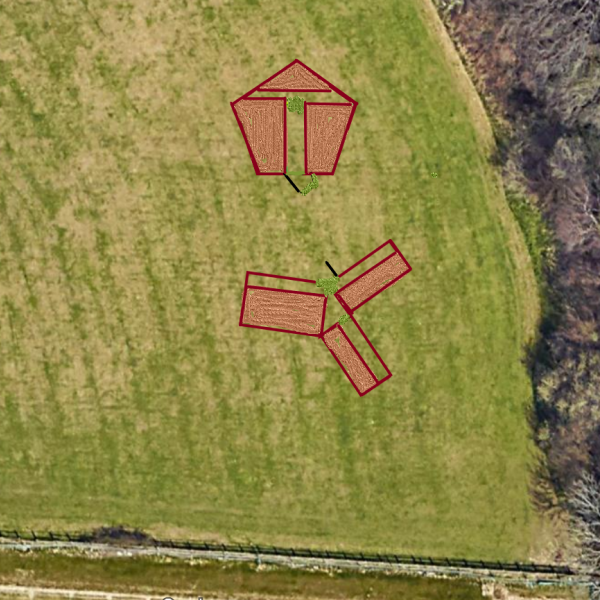 An aerial view of a field showing  plots selected for mini forests