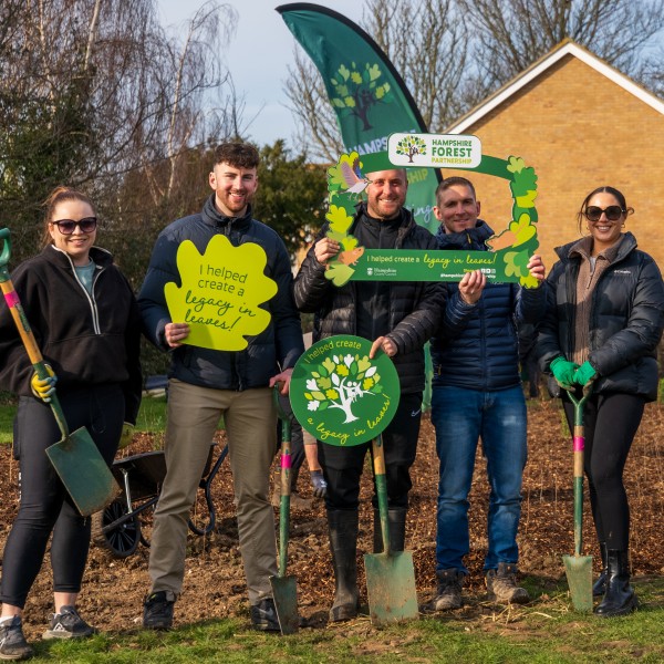 Group of adult volunteers at a tree planting event