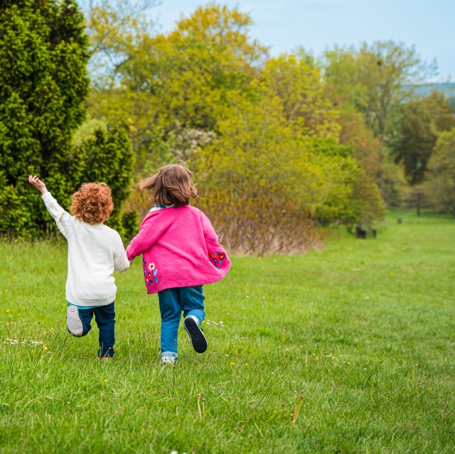 Children running across a field