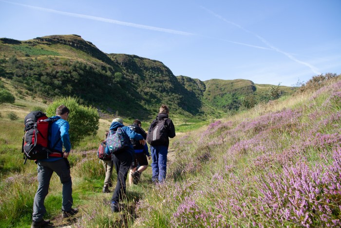 Hikers walking through the countryside