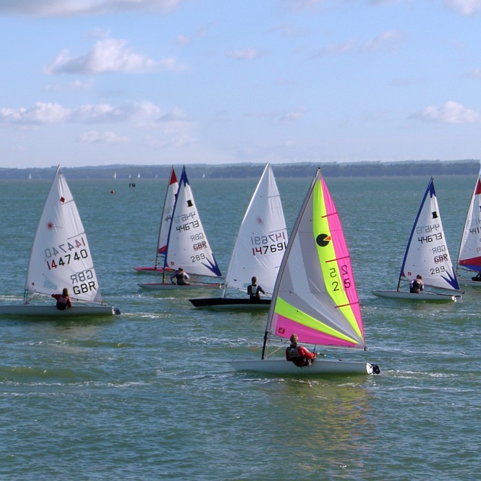 Two adults sailing a boat