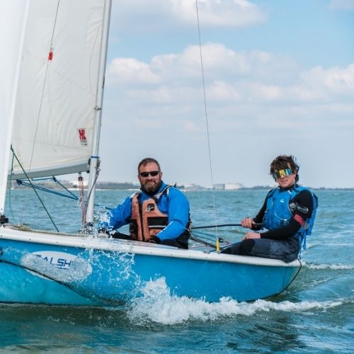 Two men on a sailing boat