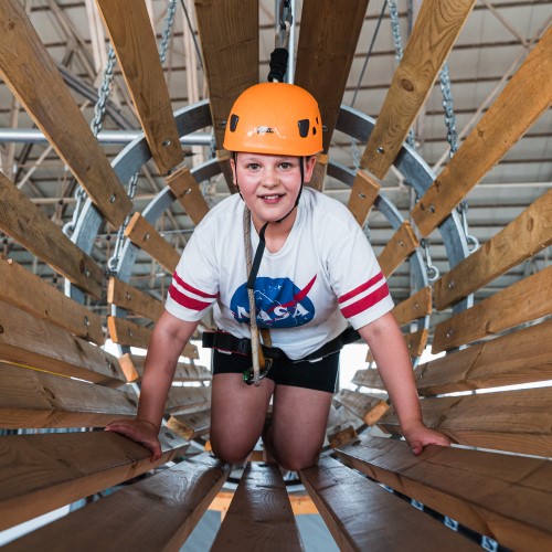 Girl on the Aerotrek high ropes