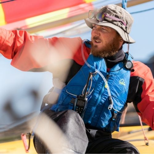 A man on a sailing boat
