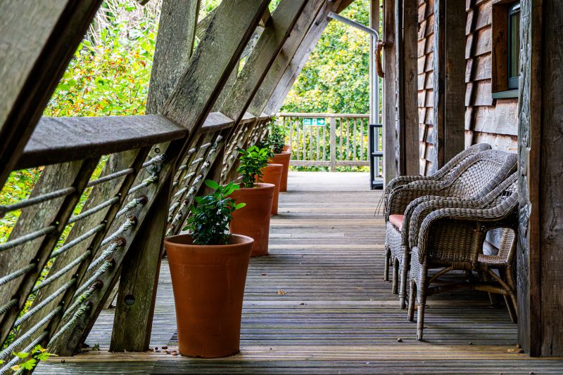 Balcony walk way with wide space and level surface.