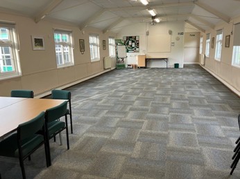 Large, flexible meeting space with table and chairs