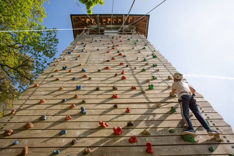 child on climbing wall