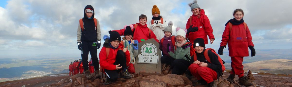 school children at a mountain peak