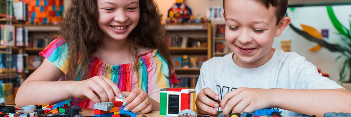 Two children playing with toy bricks