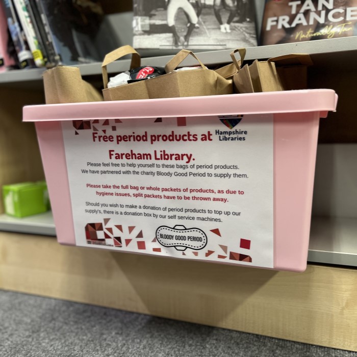 Box of free period products on a shelf