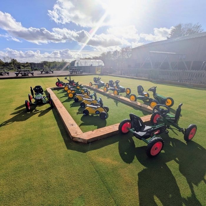 The fleet of ride on tractors and picnic benches at Manor Farm