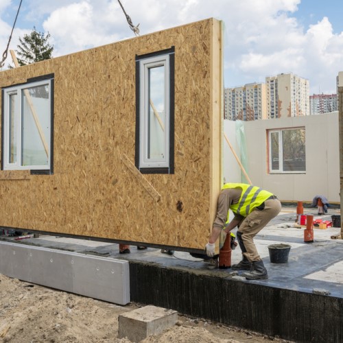  A modular housing construction with workers