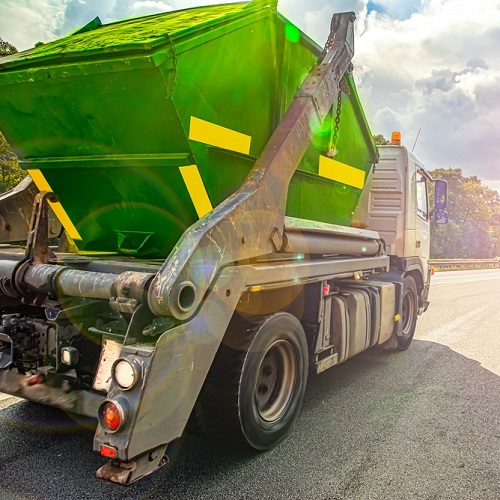 A truck delivering a skip