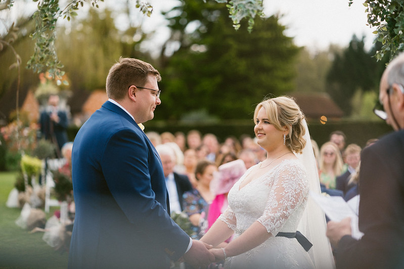 Bride and groom taking their vows at outdoor ceremony