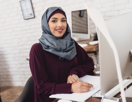 Adult sitting at computer