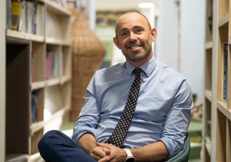 Teacher in a library setting